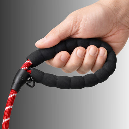 Hand holding padded handle of Spannerlife dog lead showing comfortable grip